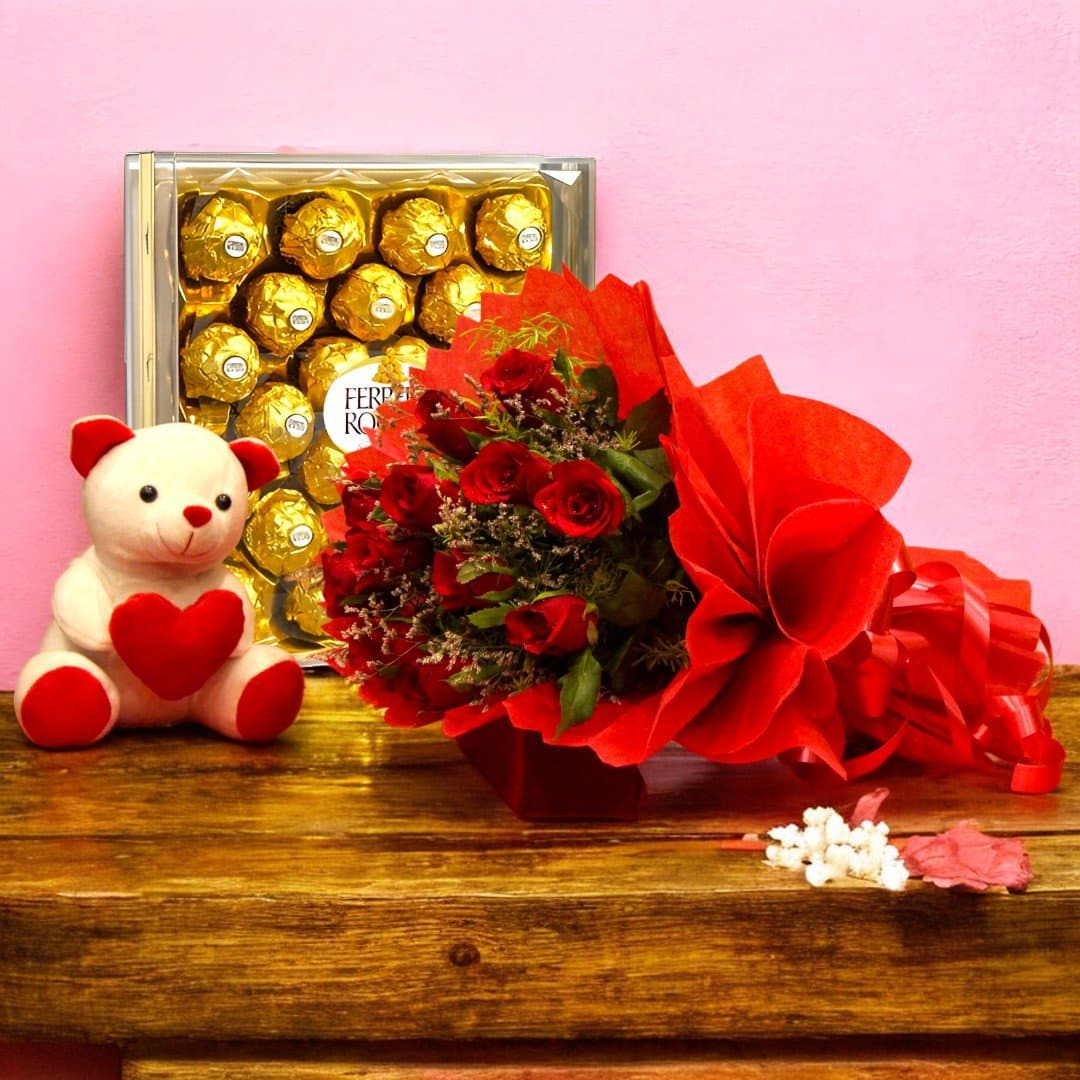 BetterGiftFlowers combo of red rose bouquet with a heart teddy and Ferrero Rocher chocolates.