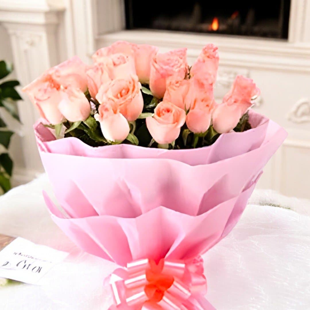 Close-up of fresh pink roses wrapped in pink paper by BetterGiftFlowers.