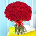 Better Gift Flowers Yours Forever 100 Red Roses Bouquet, a luxurious arrangement of fresh roses tied with a red ribbon, ideal for special occasions.