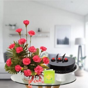 pink carnations with chocolate cake