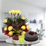 yellow carnations and chocolate cake