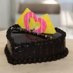 Heart Shape Chocolate Truffle Cake from BetterGiftFlowers with decorative hearts and chocolate detailing.